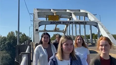 Group of students walking on Edmund Pettus Bridge.