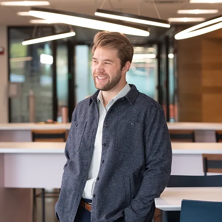 Photo of man standing in a classroom